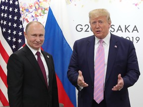 Russian President Vladimir Putin and U.S. President Donald Trump hold a meeting on the sidelines of the G20 summit in Osaka on June 28, 2019. (MIKHAIL KLIMENTYEV/AFP/Getty Images)