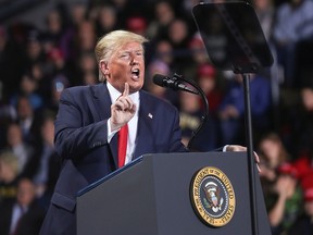 President Donald Trump reacts while speaking during a campaign rally in Battle Creek, Michigan, December 18, 2019. (REUTERS/Leah Millis/File Photo)