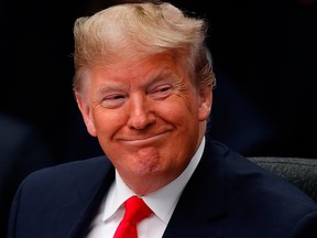 U.S. President Donald Trump smiles during the plenary session of the NATO summit at the Grove hotel in Watford, northeast of London on December 4, 2019.