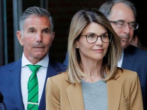 Actor Lori Loughlin, and her husband, fashion designer Mossimo Giannulli, leave the federal courthouse after facing charges in a nationwide college admissions cheating scheme, in Boston, Massachusetts, U.S., April 3, 2019.