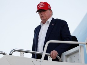 U.S. President Donald Trump descends from Air Force One at Palm Beach International Airport in West Palm Beach, Florida, U.S.  November 29, 2019.