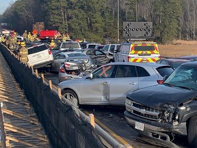 Damaged vehicles are seen after a chain reaction crash on I-64 in York County, Virginia, on December 22, 2019 in this image obtained from social media. (VA State Police/via REUTERS)