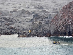 This handout photo taken and released on December 13, 2019 by the New Zealand Defence Force shows elite soldiers taking part in a mission to retrieve bodies from White Island after the December 9 volcanic eruption, off the coast from Whakatane on the North Island. (HANDOUT/NEW ZEALAND DEFENCE FORCE/AFP via Getty Images)