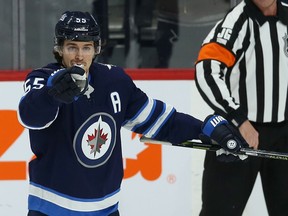 Winnipeg Jets centre Mark Scheifele points at a teammate after scoring against the Anaheim Ducks in Winnipeg on Sunday.