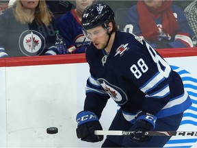 Winnipeg Jets defenceman Nathan Beaulieu keeps his eye on puck during game against the Chicago Blackhawks at Bell MTS Place in Winnipeg on Dec. 19, 2019.