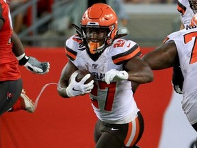 Kareem Hunt of the Cleveland Browns rushes during a preseason game against the Tampa Bay Buccaneers at Raymond James Stadium on August 23, 2019 in Tampa, Florida.