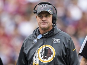 Head coach Jay Gruden of the Washington Redskins looks on against the New England Patriots during the first half at FedExField on October 6, 2019 in Landover, Maryland.