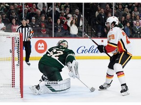 Dillon Dube of the Calgary Flames scores a goal against goalie Alex Stalock of the Minnesota Wild during the shootout of the game at Xcel Energy Center on Jan. 5, 2020 in St Paul, Minn.