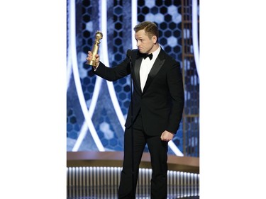 BEVERLY HILLS, CALIFORNIA - JANUARY 05: In this handout photo provided by NBCUniversal Media, LLC,  Taron Egerton accepts the award for  BEST PERFORMANCE BY AN ACTOR IN A MOTION PICTURE - MUSICAL OR COMEDY for "Rocketman" onstage during the 77th Annual Golden Globe Awards at The Beverly Hilton Hotel on January 5, 2020 in Beverly Hills, California.