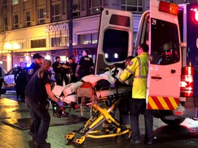 EMT and Police give first aid to a shooting victim in downtown on January 22, 2020 in Seattle, Washington.