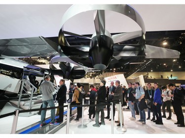 Attendees wait in line to sit inside a full-scale mockup of the Bell Nexus 4EX air taxi concept at CES 2020 at the Las Vegas Convention Center on Jan. 8, 2020, in Las Vegas.