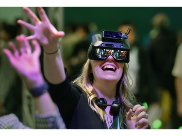 Attendee Angela Boersma participates in an augmented reality exercise at the Realmax booth during CES 2020 at the Las Vegas Convention Center 
on Jan. 8, 2020, in Las Vegas.