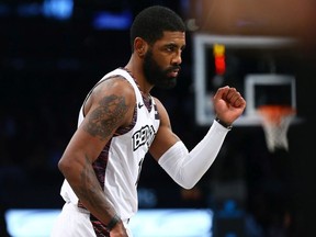Kyrie Irving of the Brooklyn Nets pumps his fist against the against the Atlanta Hawks at Barclays Center on Jan. 12, 2020 in New York City.