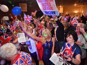 Guests celebrate the moment the UK leaves the EU during the Brexit party at Woolston Social Club on January 31, 2020 in Warrington, United Kingdom.