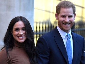 Prince Harry and his wife Meghan, Duchess of Sussex, react as they leave after their visit to Canada House in London, Jan. 7, 2020. (Daniel Leal-Olivas/Pool via REUTERS)