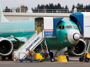 An employee works near a Boeing 737 Max aircraft at Boeing's 737 Max production facility in Renton, Washington, U.S. Dec. 16, 2019. (REUTERS/Lindsey Wasson/File Photo)