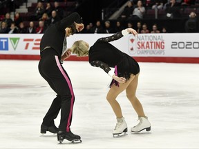 Piper Gilles' hair gets caught in partner Paul Poirier's costume in the senior ice dance rhythm during the 2020 Canadian National Skating Championship at Paramount Fine Foods Centre, Mississauga, Ont., Jan. 17, 2020. (Eric Bolte-USA TODAY Sports)