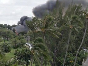 Smoke billowing from a fire at Kapi'Olani park during a shooting in Honolulu, Hawaii in this still image obtained from a Twitter video on Jan. 19, 2020.