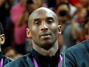 U.S. basketball player Kobe Bryant listens to the national anthem during the Gold Medal victory ceremony at the North Greenwich Arena during the London 2012 Olympic Games August 12, 2012. (REUTERS/Mike Segar/File Photo)