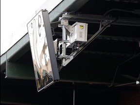 In this July 10, 2019, file photo, a radar device is seen on the roof behind home plate at PeoplesBank Park during the third inning of the Atlantic League All-Star minor league baseball game in York, Pa.  (AP Photo/Julio Cortez, File)