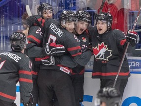 Canada's Dylan Cozens (22, back left) celebrates with teammates (left to right) Alexis Lafreniere, Joe Veleno, Barrett Hayton and Calen Addison after scoring the first goal against Russia during second period action in the gold medal game at the World Junior Hockey Championships, Sunday, January 5, 2020 in Ostrava, Czech Republic. THE CANADIAN PRESS/Ryan Remiorz