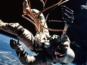 Astronaut Ed White moves away from the Gemini 4 capsule in this 1965 file photo. White, the first American spacewalker, lost a spare glove when he went outside for the first time. From that time on, astronauts have accidentally added some of the more unusual items to the 100,000 pieces of space trash that circle Earth. The Canadian military is looking for help taking out the trash in space. Over the last two years, the military's Innovation for Defence Excellence and Security program has awarded nearly $5 million in contracts to Canadian companies and university researchers to find ways to identify some of the millions of pieces of junk orbiting the Earth.