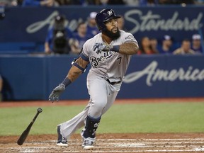 Eric Thames of the Milwaukee Brewers hits a double in the sixth inning during MLB game action against the Toronto Blue Jays at Rogers Centre on April 12, 2017 in Toronto, Canada.