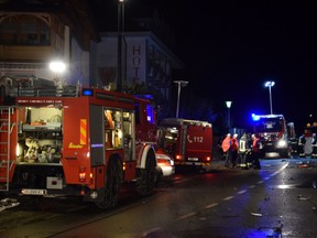 Firefighters attend to the scene where a male driver of a car hit a group of German tourists, killing six in Lutago, Italy, Jan. 5, 2020. (Vigili del Fuoco Lutago/Handout via REUTERS)