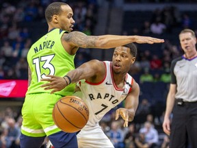 Toronto Raptors guard Kyle Lowry passes the ball around Minnesota Timberwolves guard Shabazz Napier in the first half at Target Center in Minneapolis on Saturday, Jan. 18, 2020.