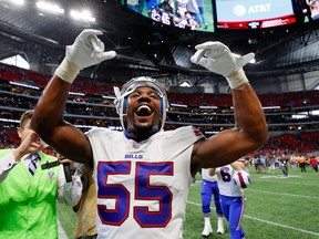 Jerry Hughes of the Buffalo Bills celebrates beating the Atlanta Falcons at Mercedes-Benz Stadium on October 1, 2017 in Atlanta, Georgia.