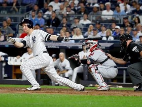 Todd Frazier of the New York Yankees hits a double to left field to score Starlin Castro against Trevor Bauer of the Cleveland Indians during the second inning in Game Four of the American League Divisional Series at Yankee Stadium on October 9, 2017 in the Bronx borough of New York City.