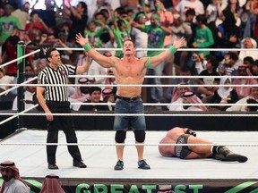 John Cena celebrates defeating Triple H  during the World Wrestling Entertainment (WWE) Greatest Royal Rumble event in the Saudi coastal city of Jeddah on April 27, 2018.