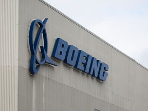 In this file photo taken on March 12, 2019 the Boeing logo is pictured at the Boeing Renton Factory in Renton, Washington.