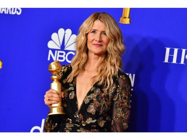 US actress Laura Dern poses in the press room with the award for Best Performance by an Actress in a Supporting Role in any Motion Picture during the 77th annual Golden Globe Awards on January 5, 2020, at The Beverly Hilton hotel in Beverly Hills, California. (Photo by FREDERIC J. BROWN / AFP)