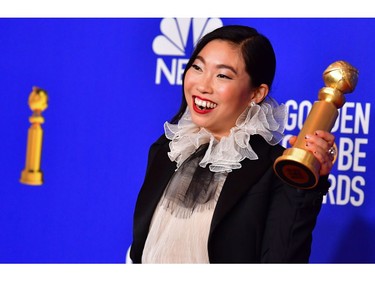 US actress Awkwafina poses in the press room with the award for Best Performance by an Actress in a Motion Picture - Musical or Comedy during the 77th annual Golden Globe Awards on January 5, 2020, at The Beverly Hilton hotel in Beverly Hills, California. (Photo by FREDERIC J. BROWN / AFP)