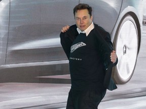 Tesla CEO Elon Musk dances during the Tesla China-made Model 3 delivery launch in Shanghai, Jan. 7, 2020. (STR/AFP via Getty Images)