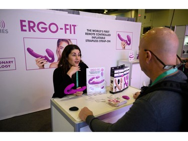 An Ergo-Fit representatives talks about the Ergo-fit sex toy at the 2020 Consumer Electronics Show (CES) in Las Vegas, Nevada, January 7, 2020. - For the first time sex tech is making an appearance at CES in the health and wellness section of the giant electronics and gadget fair. (Photo by Robyn Beck / AFP)