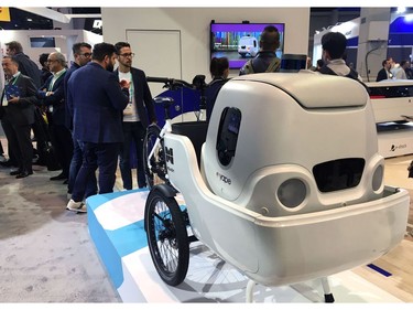 An electric cargo bike from Italian startup Measy is seen with a delivery robot from sister company Yape as part of a demonstration of multimodal transportation at the 2020 Consumer Electronics Show (CES) in Las Vegas on Jan. 7, 2020.