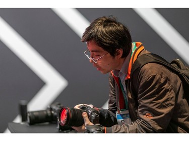 A man looks at Canon cameras at the 2020 Consumer Electronics Show (CES) in Las Vegas on Jan. 8, 2020.