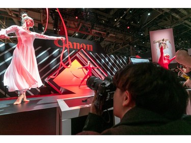 A man tries out a Canon camera at the 2020 Consumer Electronics Show (CES) in Las Vegas, Nevada on Jan. 8, 2020.