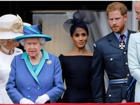 In this file photo taken on July 10, 2018 (L-R) Britain's Camilla, Duchess of Cornwall, Britain's Queen Elizabeth II, Britain's Meghan, Duchess of Sussex, Britain's Prince Harry, Duke of Sussex, AND Britain's Prince William, Duke of Cambridge come onto the balcony of Buckingham Palace to watch a military fly-past to mark the centenary of the Royal Air Force (RAF).