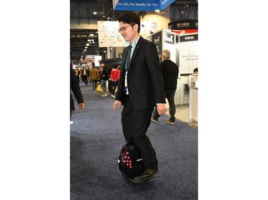 Jason Jiao of Shenzhen, China-based Inmotion Technologies rides Inmotion's newest monowheel, the Inmotion V8F at the 2020 Consumer Electronics Show (CES) in Las Vegas on Jan. 9, 2020.