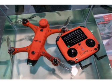 The Swellpro Spry+ waterproof drone and its floating controller are displayed floating on water at the 2020 Consumer Electronics Show (CES) 
in Las Vegas on Jan. 9, 2020.