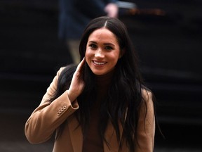 In this file photo taken on January 07, 2020 Britain's Meghan, Duchess of Sussex reacts as she arrives to visit Canada House, in London, in thanks for the warm Canadian hospitality and support they received during their recent stay in Canada.