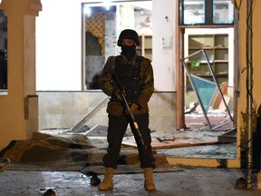 A soldier stands guard at the premises of a mosque after a bomb blast in Quetta on January 10, 2020. - At least 10 people were killed and 16 others wounded in a bomb blast during evening prayers at a mosque in southwestern Pakistan on January 10, police and a doctor said.