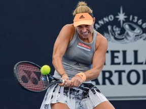 Angelique Kerber of Germany hits a return to Dayana Yastremska of the Ukraine during their women's second round singles match at the Adelaide International tennis tournament in Adelaide on January 15, 2020.