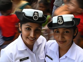Sri Lankan Navy volunteers twins pose for a picture during an event attempting to break the world record for the biggest gathering of twins, in Colombo on January 20, 2020. (LAKRUWAN WANNIARACHCHI/AFP via Getty Images)