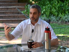 In this file photo taken on November 15, 2019 Paraguayan President Mario Abdo Benitez speaks during an interview with AFP at the yard of the Mburuvicha Roga presidential residence in Asuncion. (NORBERTO DUARTE/AFP via Getty Images)