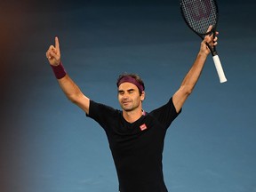 Switzerland's Roger Federer celebrates after victory against Australia's John Millman during their men's singles match on day five of the Australian Open tennis tournament in Melbourne on Jan.  24, 2020. (WILLIAM WEST/AFP via Getty Images)