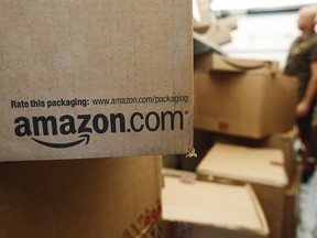 In this Oct. 18, 2010, file photo, an Amazon.com package awaits delivery in Palo Alto, Calif. (AP Photo/Paul Sakuma, File)